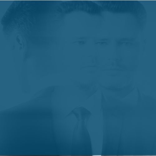 man in suit with blue overaly